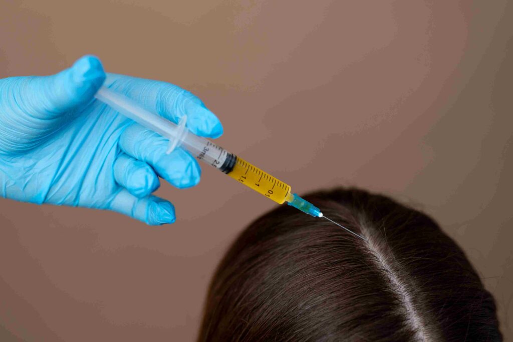 hand-giving-injection-patient-high-angle