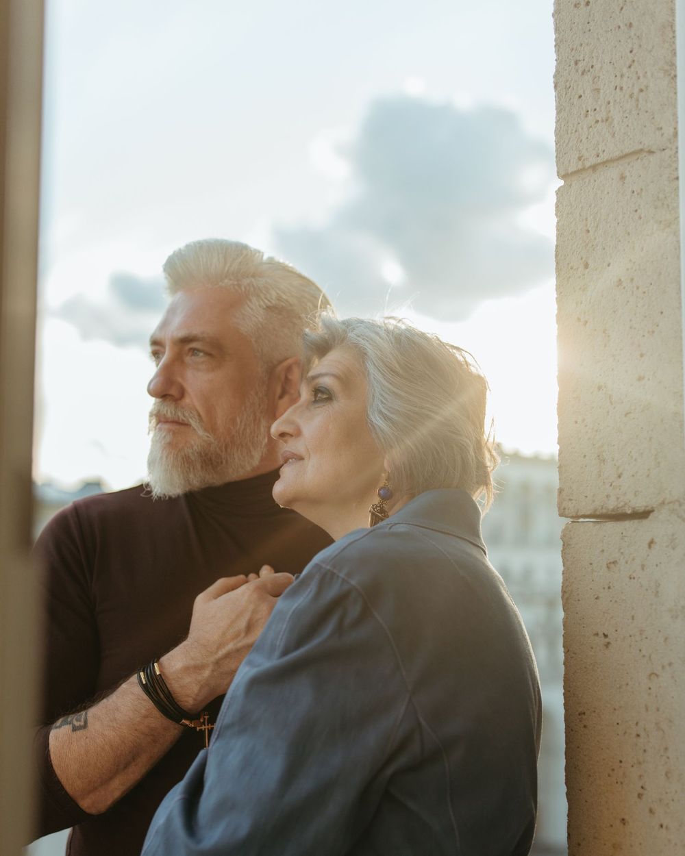 Mature couple sharing a quiet moment by the window
