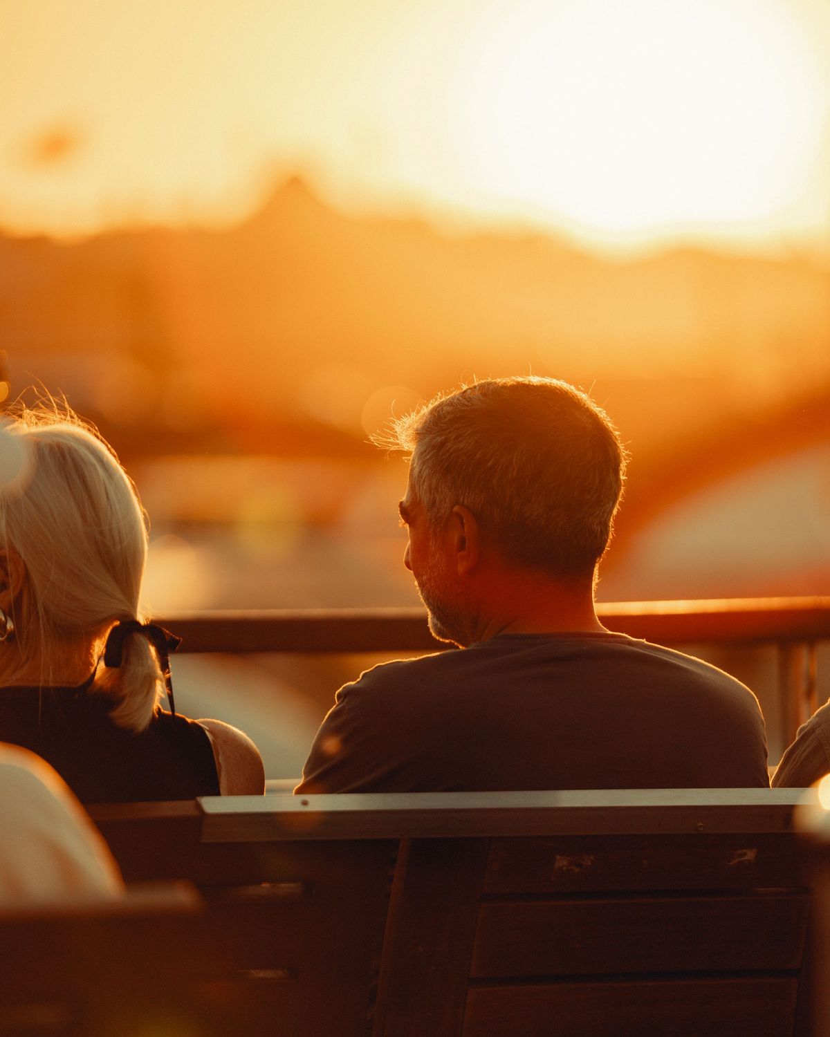 Couple watching a golden-hour sunset together
